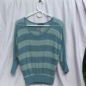 Blue and white knit top.